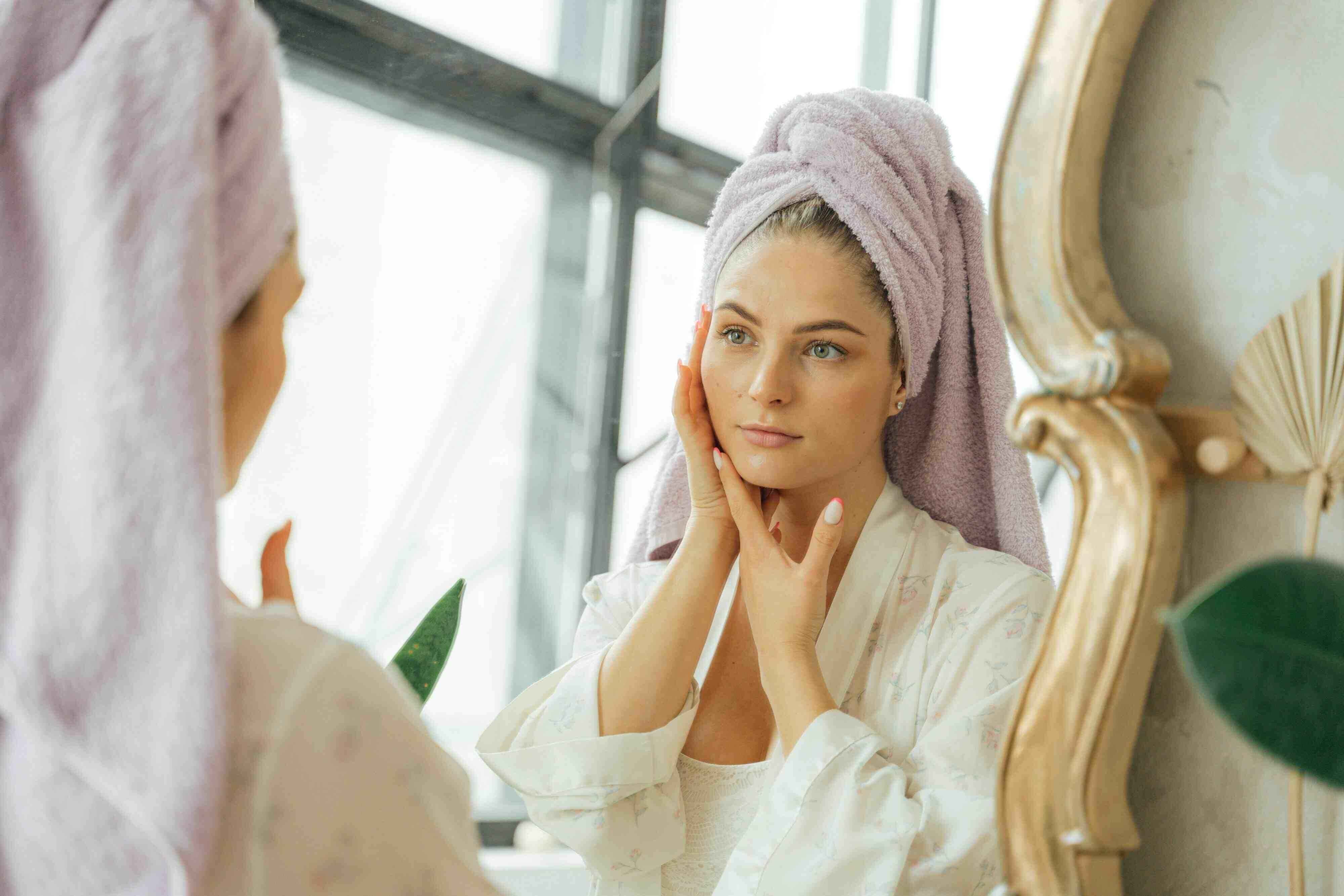 image of a woman using cocoa butter for skin