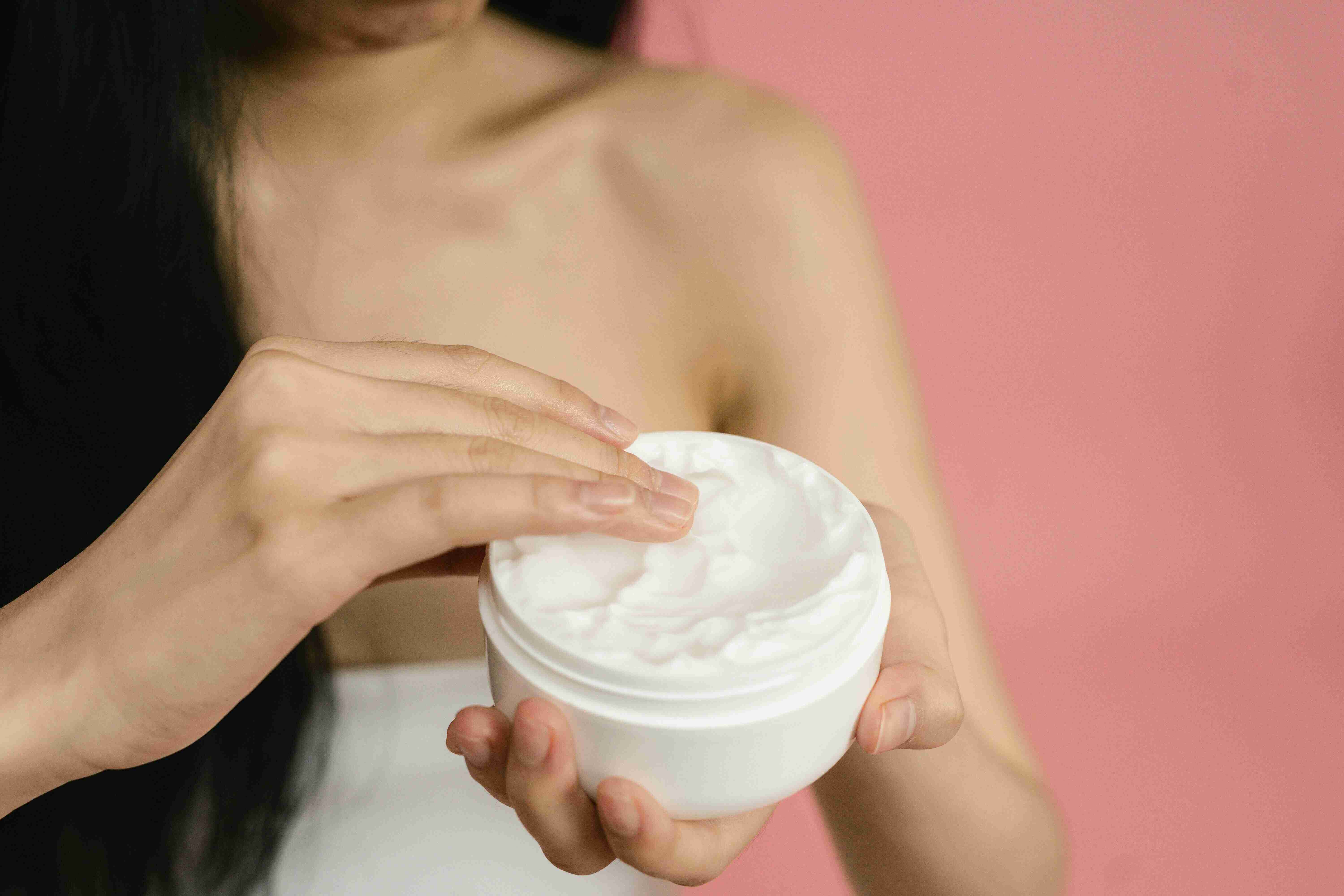 image of a woman with shea butter haircare mixture